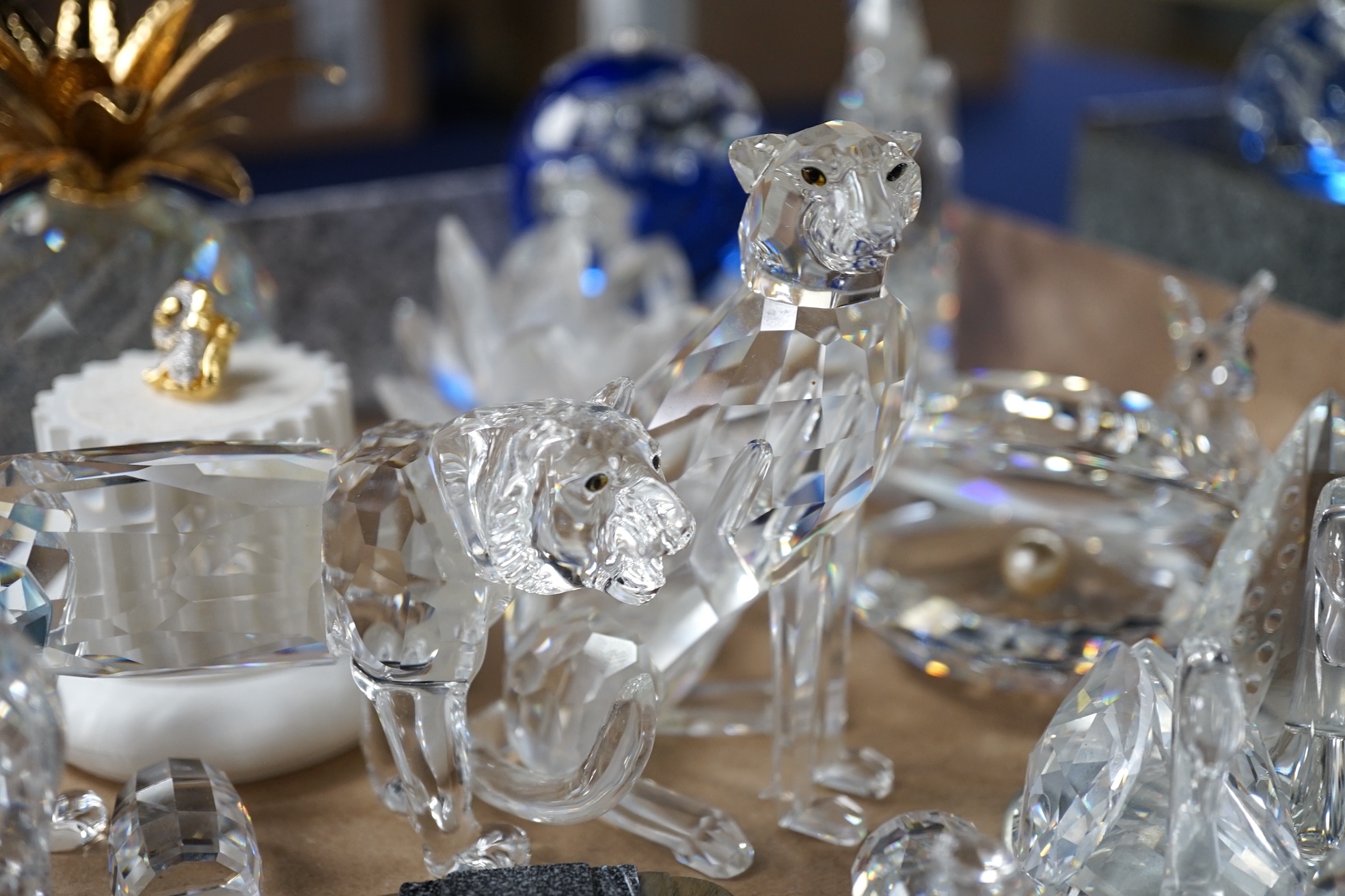 A large collection of various Swarovski crystal animals, flowers, a train on track, pots and fruit etc., train track 30cm long. Condition - mostly good